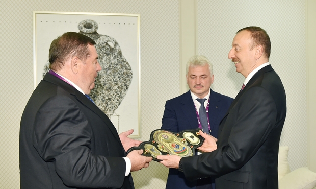 FIAS’s President Vasily Shestakov handed a championship belt in sambo to the President Ilkham Aliev
